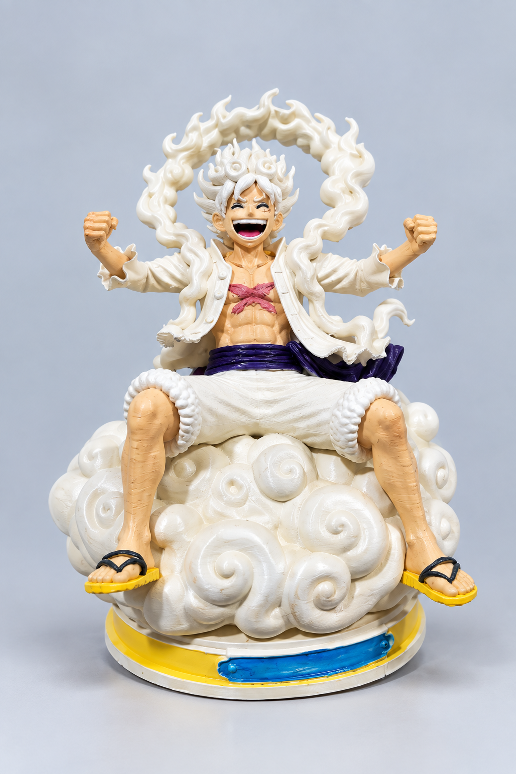 A cheerful 3D-printed figure seated on a sculpted cloud